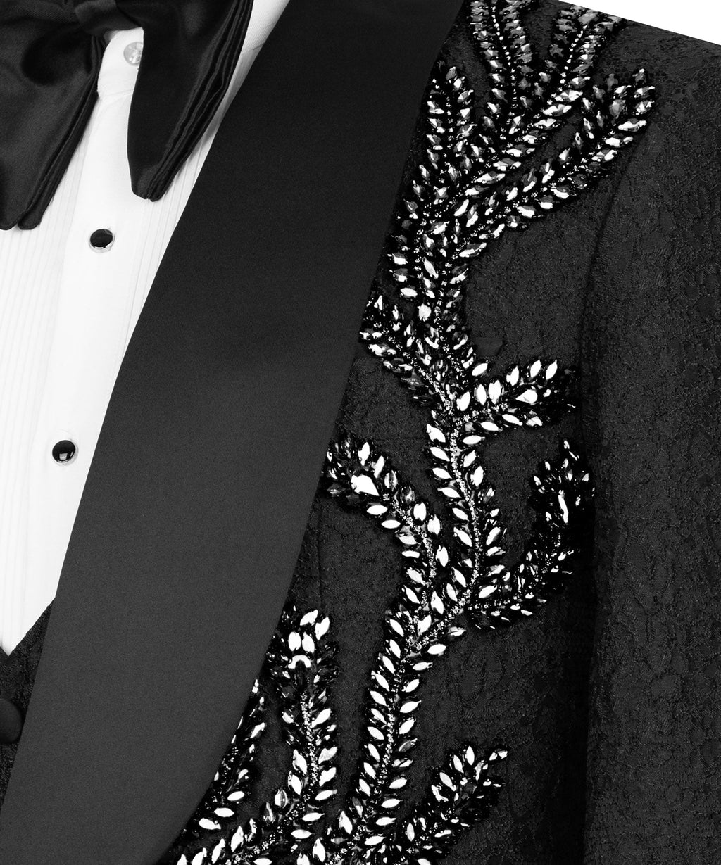 Close-up of black tuxedo lapel with embroidered stone motif and beadwork