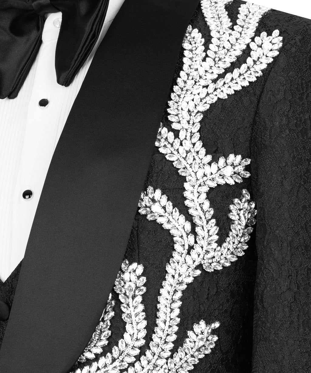 Close-up of black tuxedo lapel with silver beadwork embroidery and textured fabric
