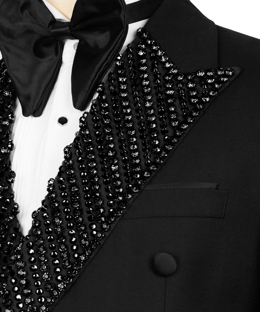 Close-up of black lapel embroidery with rhinestones and satin bow tie