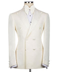Cream tuxedo jacket with bow tie; double-breasted vest front with dark buttons