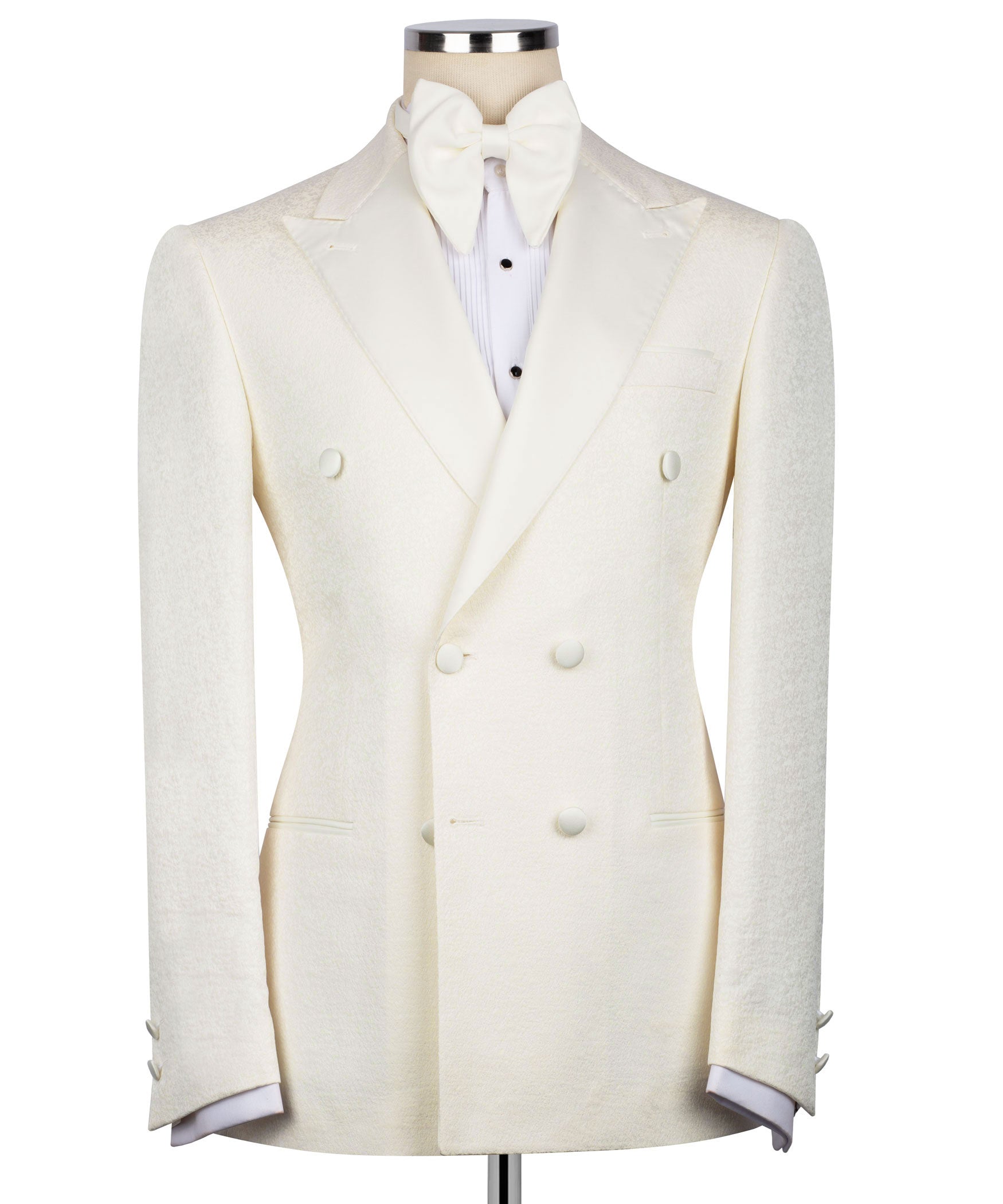 Cream tuxedo jacket with bow tie; double-breasted vest front with dark buttons
