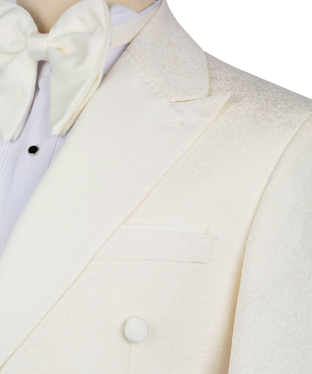 Close-up of cream tuxedo lapel and front buttons with bow tie
