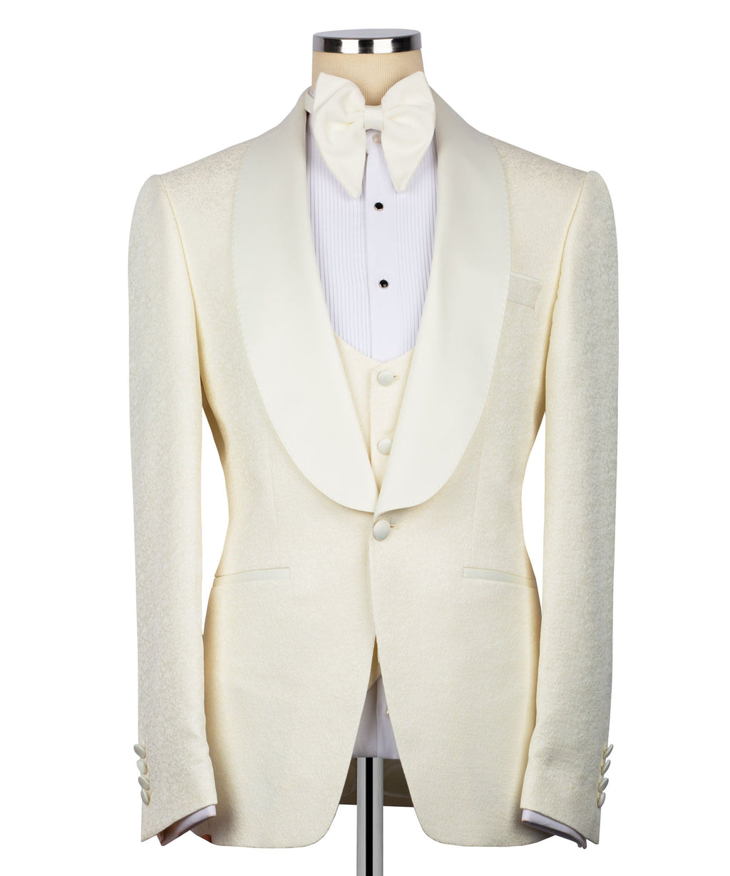 Cream tuxedo suit jacket with matching vest and bow tie, front view on mannequin