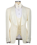 Cream three-piece tuxedo suit set with bow tie, vest, and tailored jacket front
