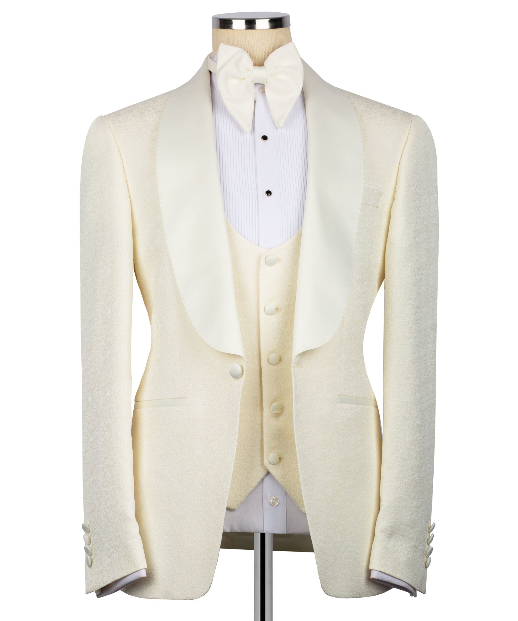 Cream three-piece tuxedo suit set with bow tie, vest, and tailored jacket front