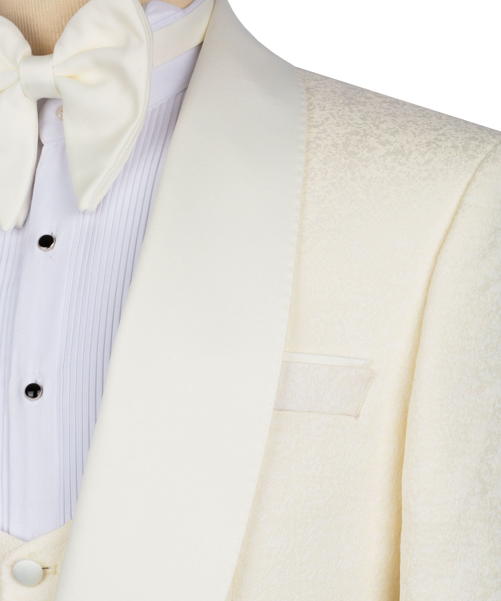 Close-up of cream tuxedo jacket lapel and light vest with bow tie and button details