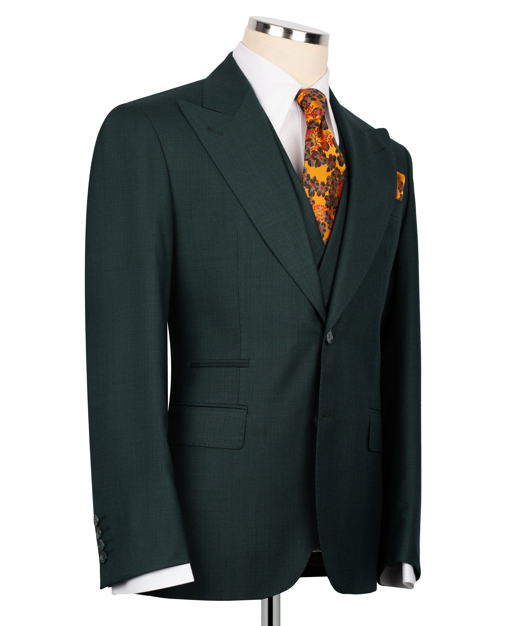 Dark green suit jacket with single-breasted front, covered buttons, and patterned tie