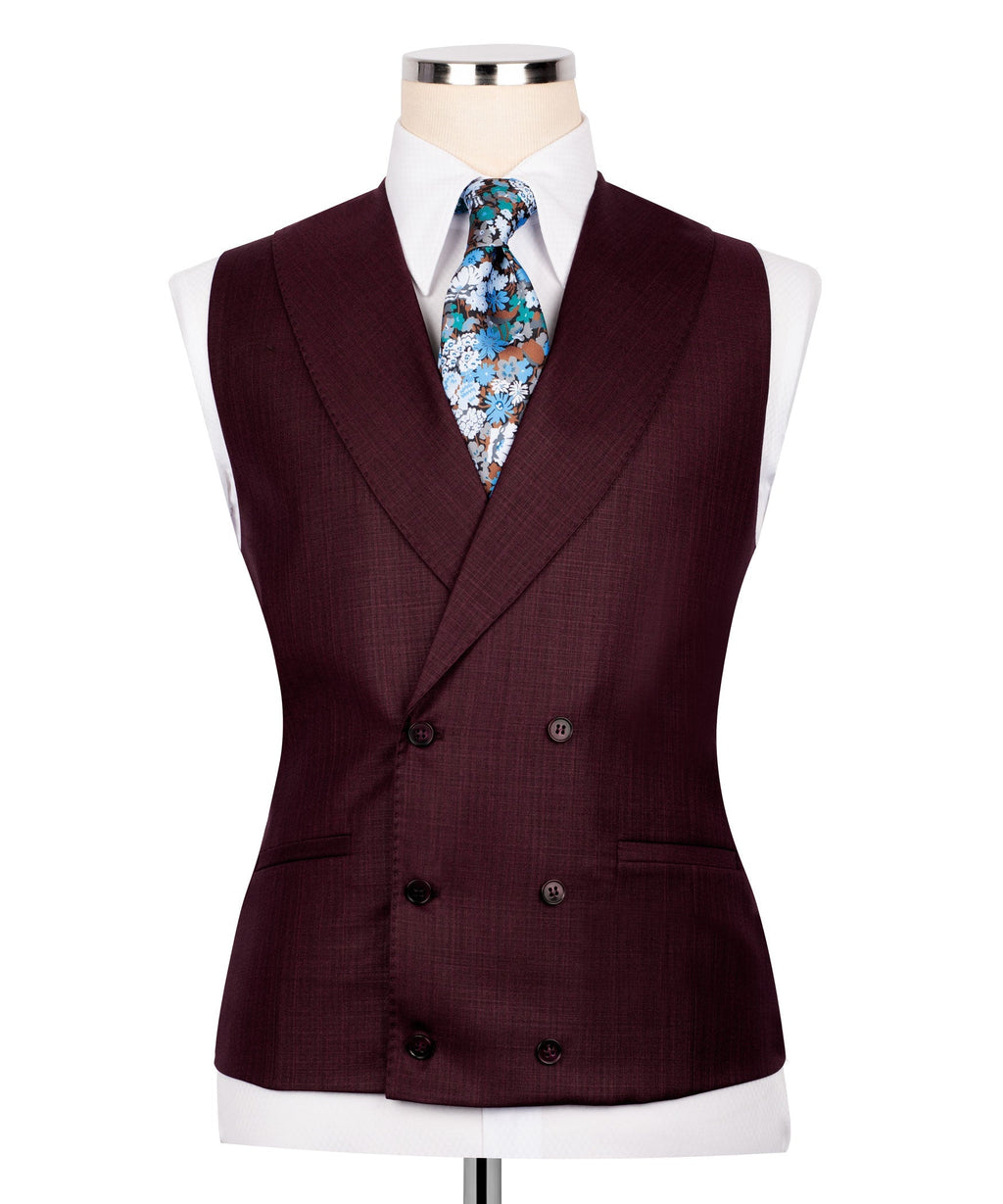Burgundy vest with floral tie and four-button front, tailored suit styling
