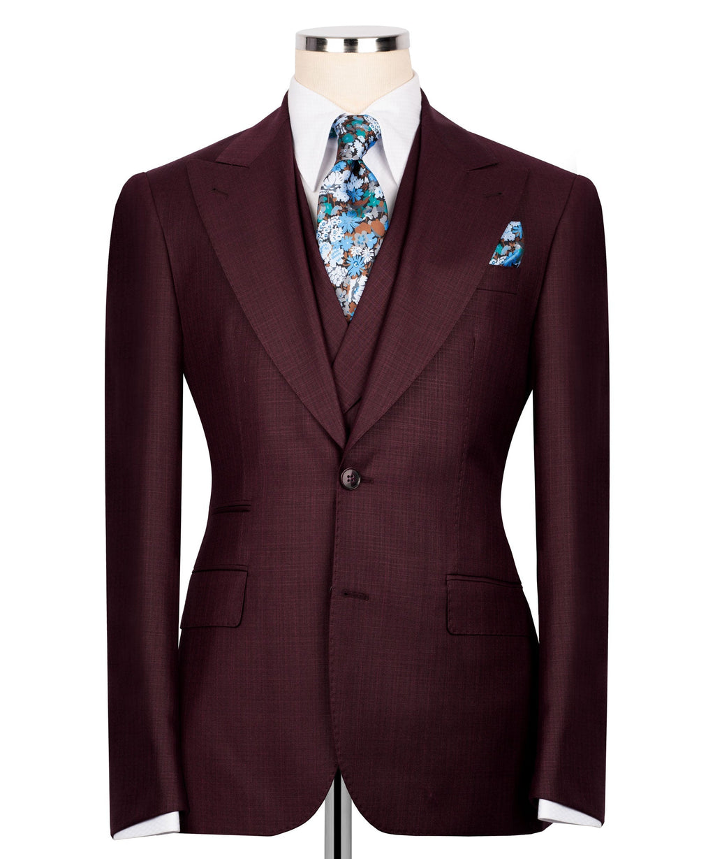 Burgundy three-piece suit jacket with floral tie and matching pocket square, front view
