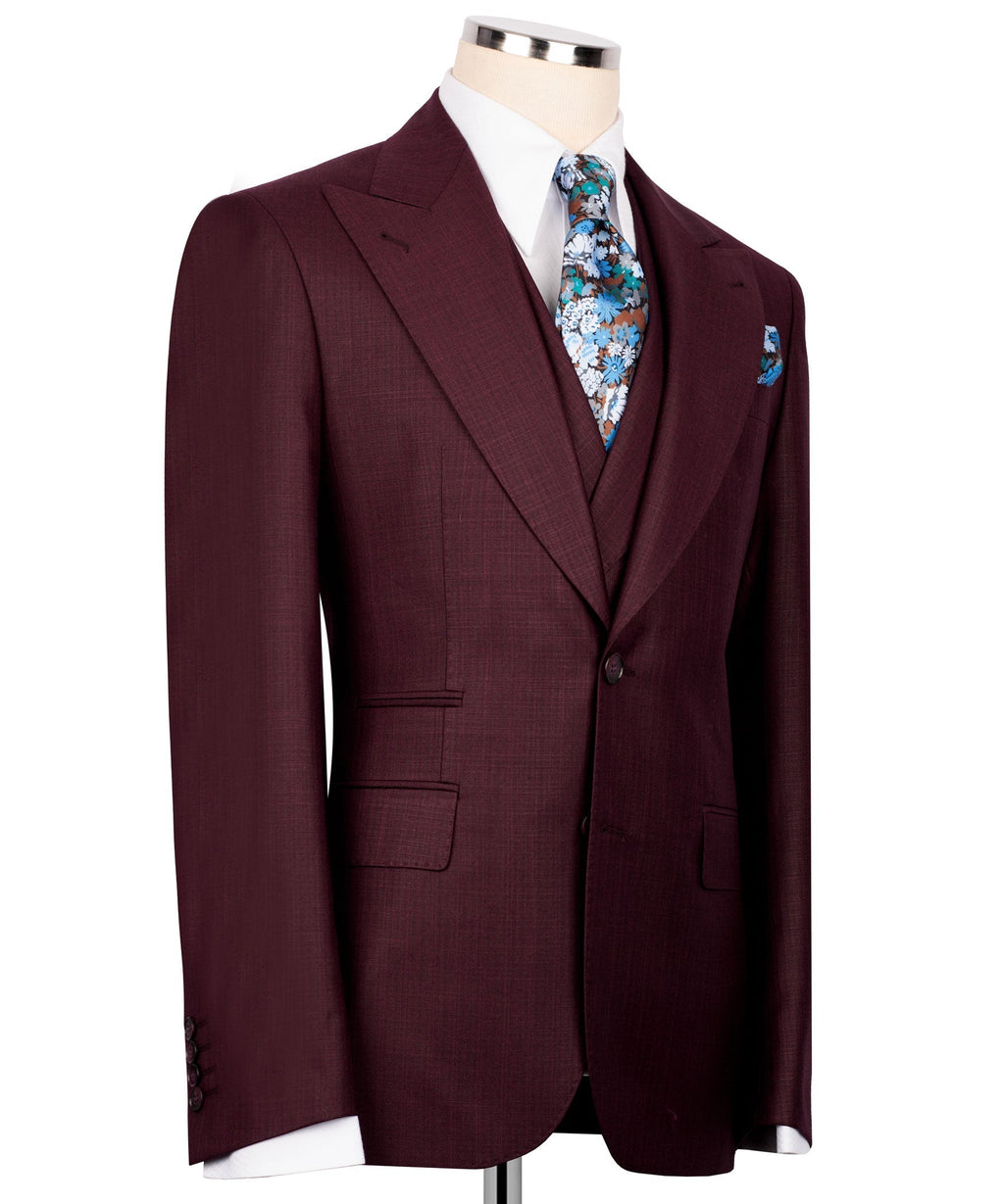 Burgundy three-piece suit jacket, floral tie at front, side view with pocket square