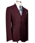 Burgundy three-piece suit jacket, floral tie at front, side view with pocket square