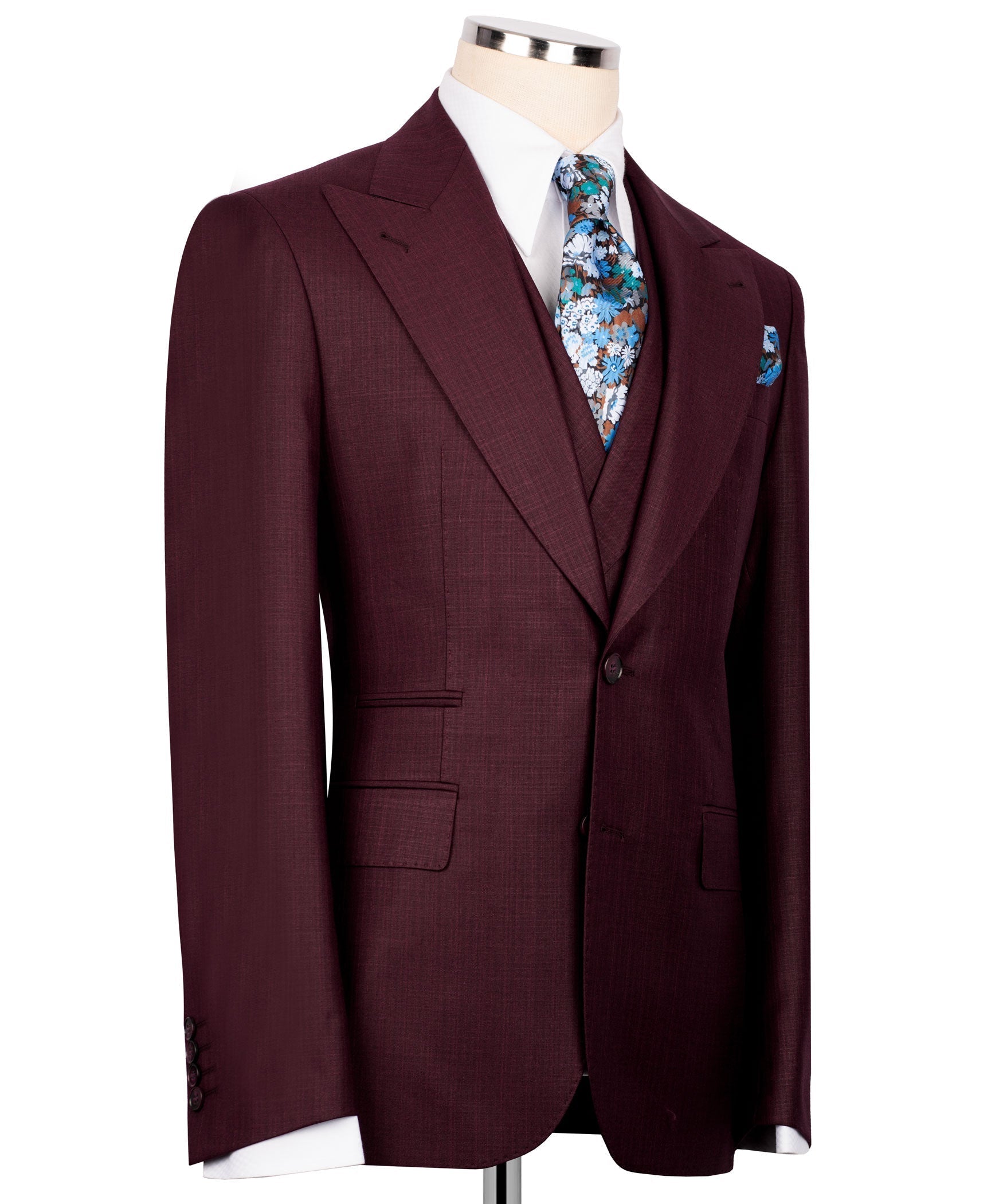 Burgundy three-piece suit jacket, floral tie at front, side view with pocket square