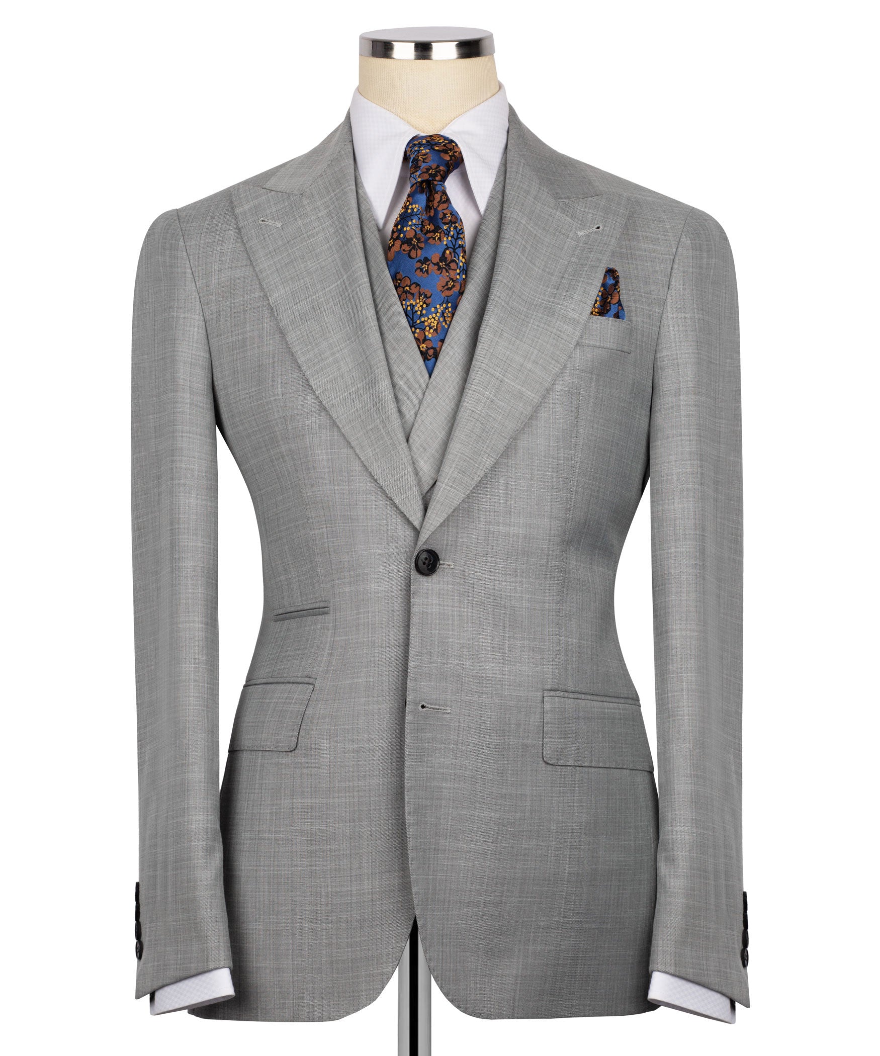 Grey suit jacket with notch lapels, dark buttons, and patterned tie at collar