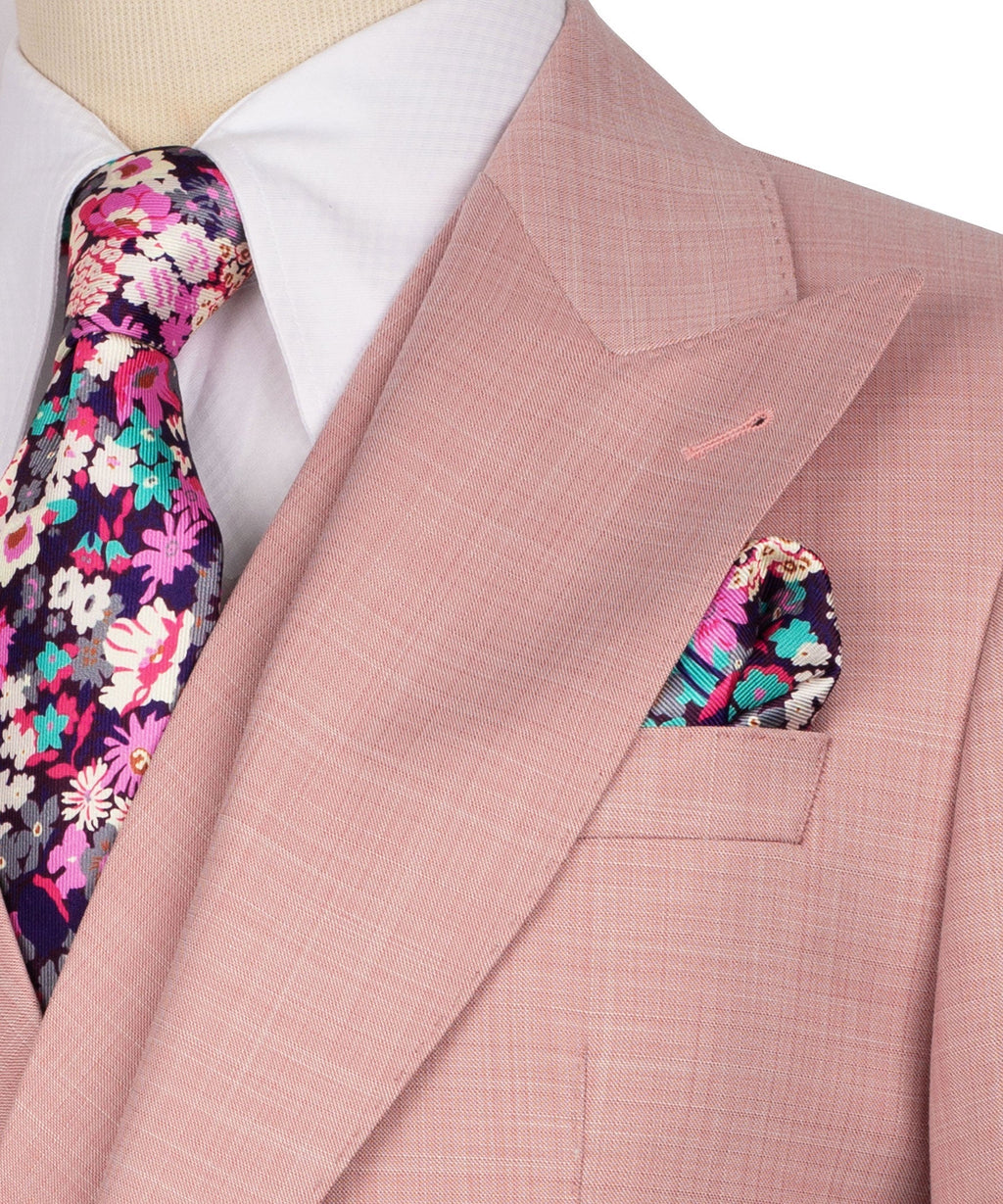 Pink blazer pocket detail: tailored breast pocket with colorful floral trim