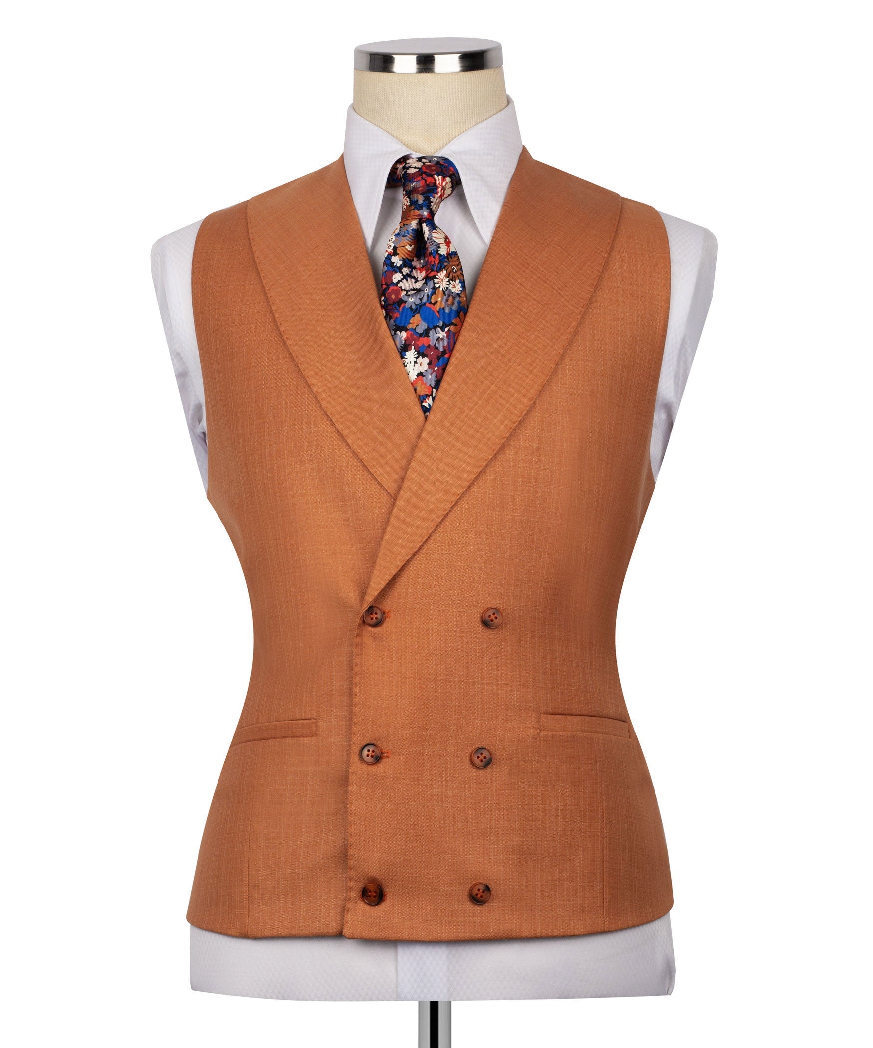 Rust-orange vest with double-breasted buttons, floral tie, and suit jacket lapels