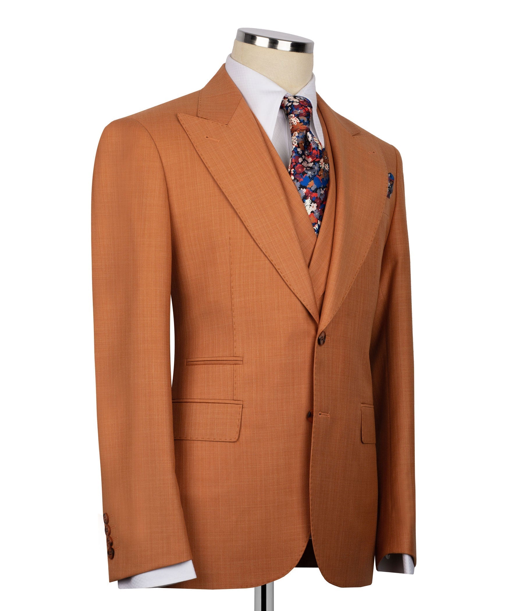 Rust-orange suit jacket with flap pockets, matching vest, and floral pocket square