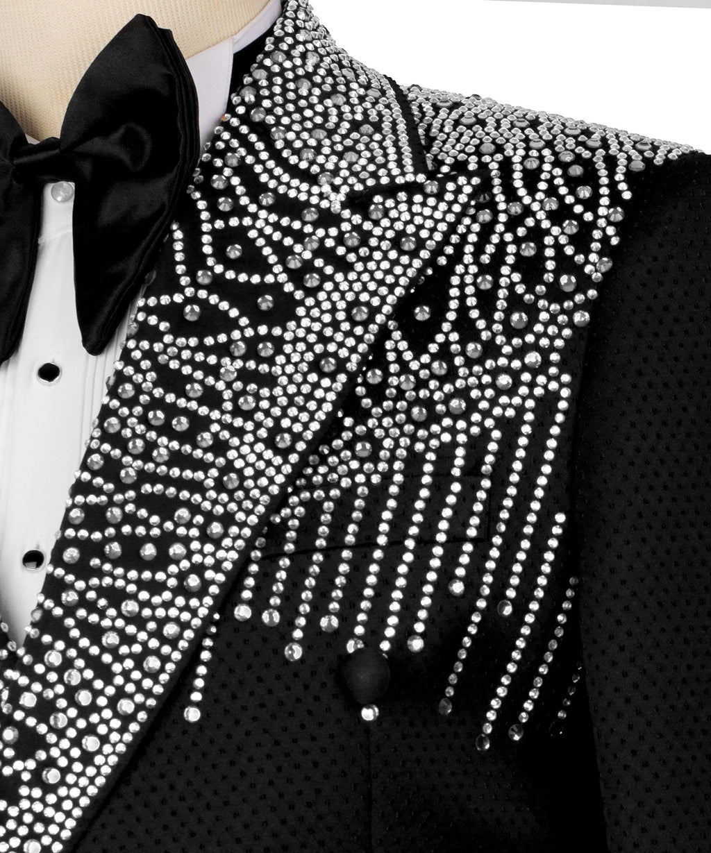 Close-up of black tuxedo jacket lapel and bow tie with silver stone fringe pattern