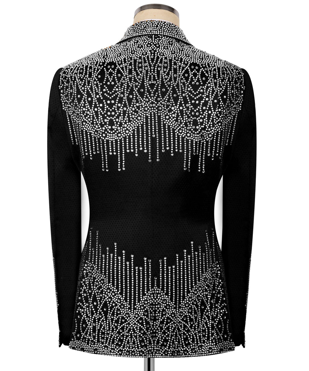 Back view: black tuxedo jacket covered in silver stone embroidery, long sleeves