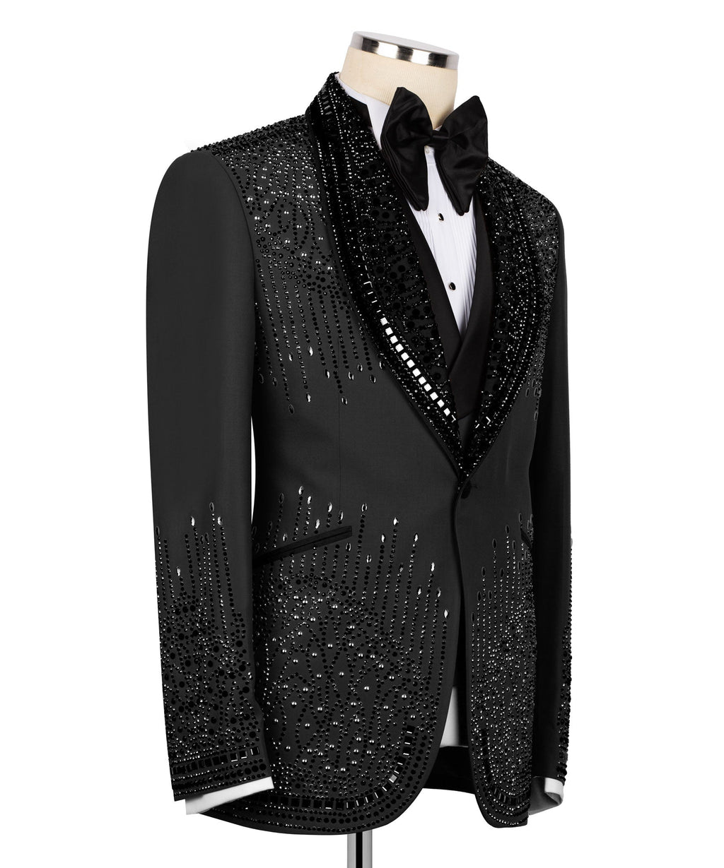 Black tuxedo jacket side view with sparkling stone embroidery along lapel and sleeves