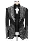 Black tuxedo jacket with silver rhinestone embroidery, black bow tie, white shirt