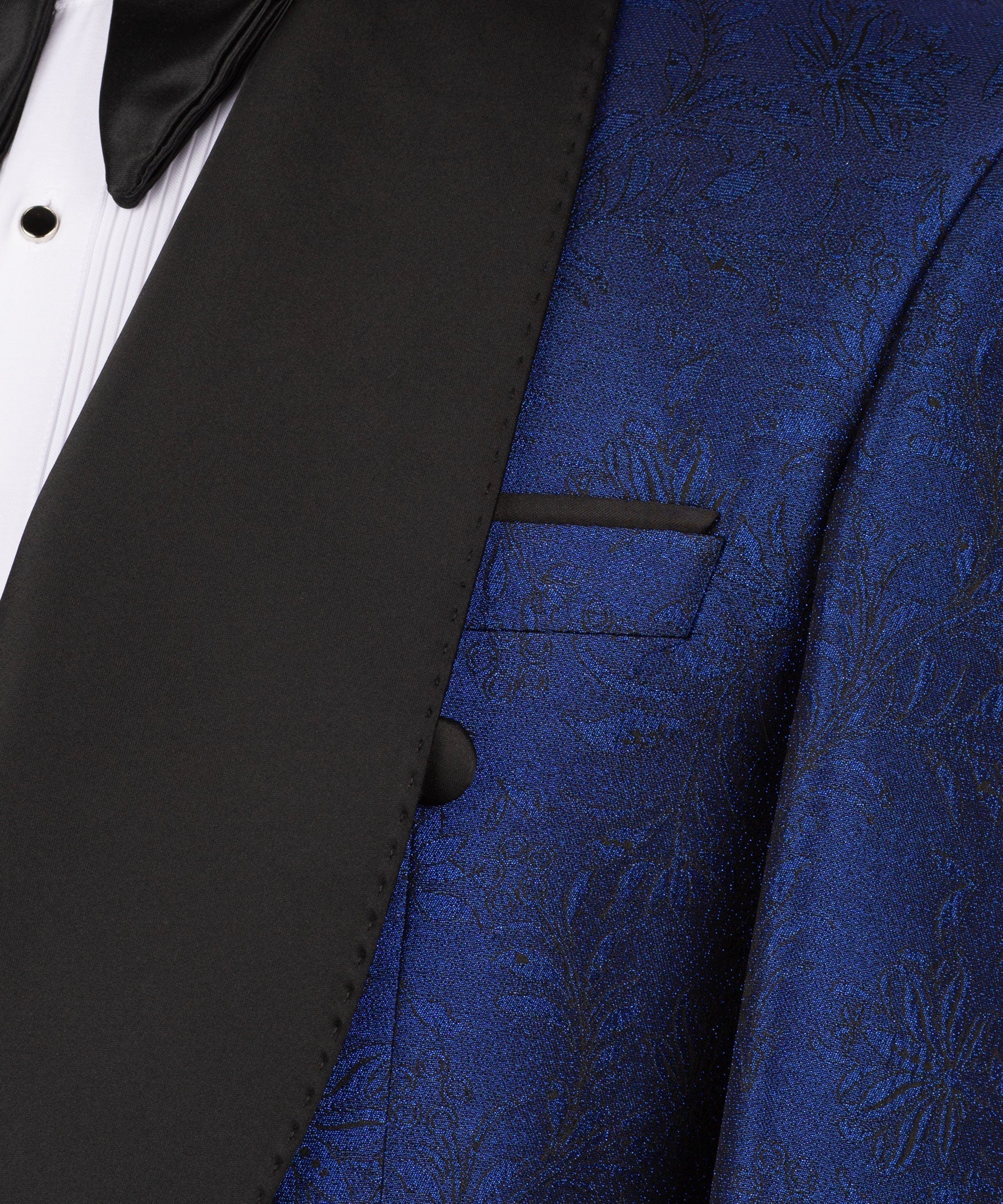 Detail view: black satin lapel and blue patterned jacket pocket with flap