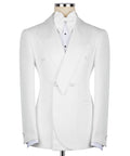 White tuxedo jacket with geometric bow tie, pointed lapels, and matching vest