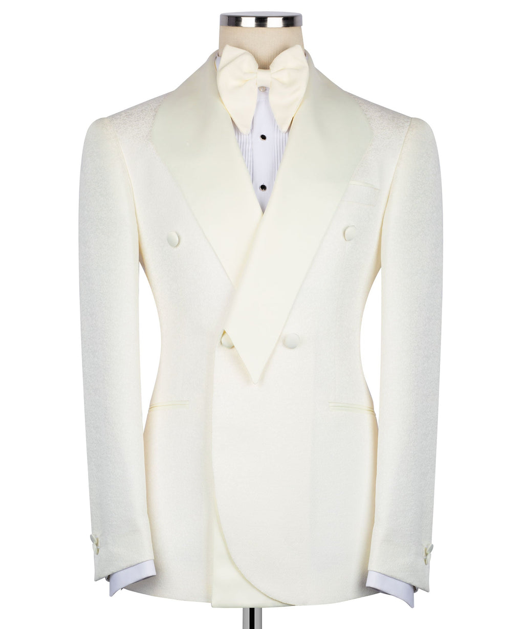 Cream tuxedo two-piece set: fitted jacket with vest, bow tie, and light blue shirt