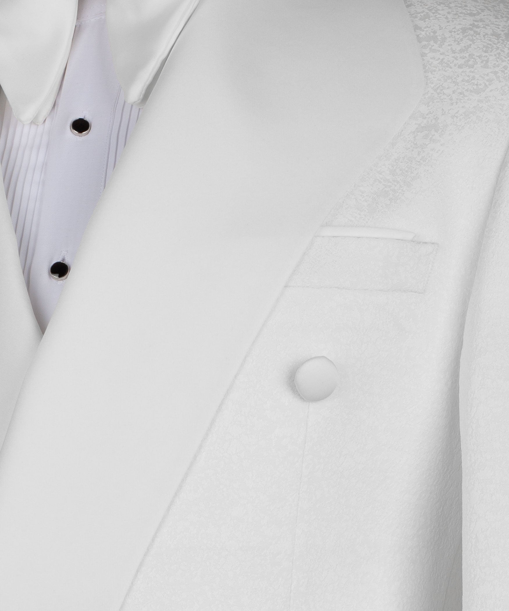 White tuxedo jacket close-up: buttoned lapels and chest welt pocket