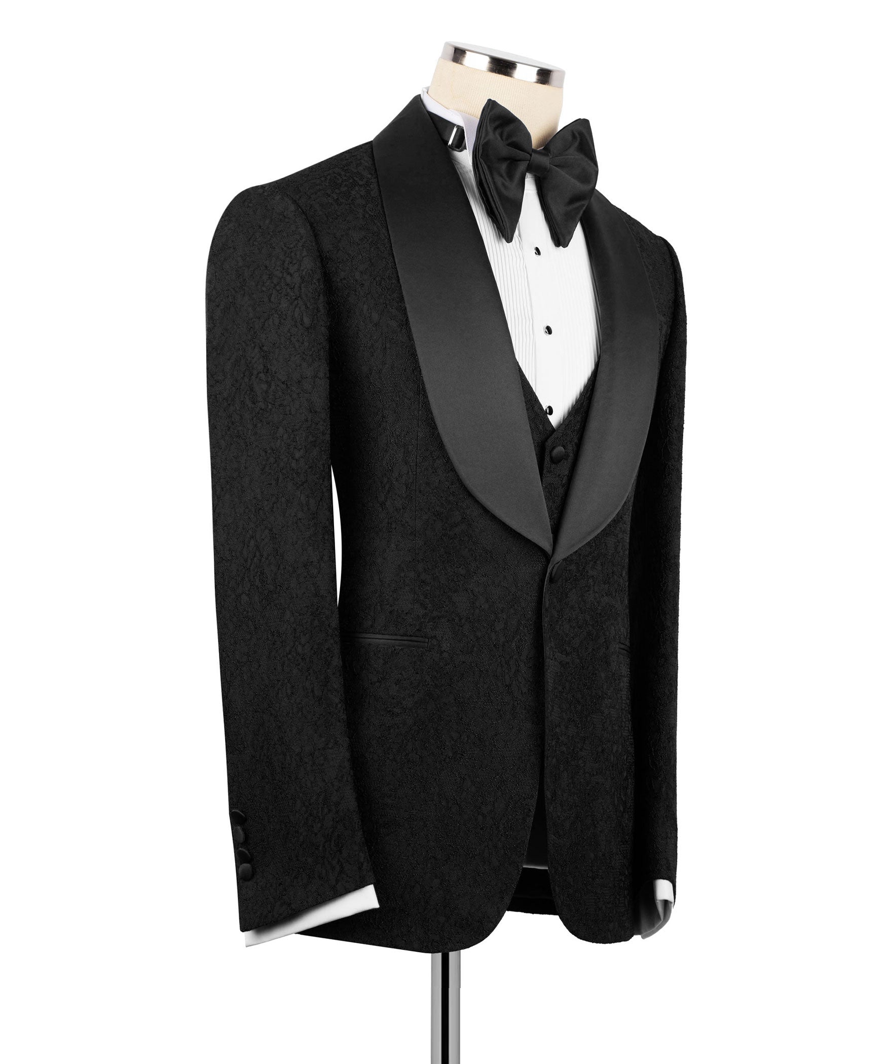 Black tuxedo jacket and waistcoat with bow tie, satin lapels on mannequin