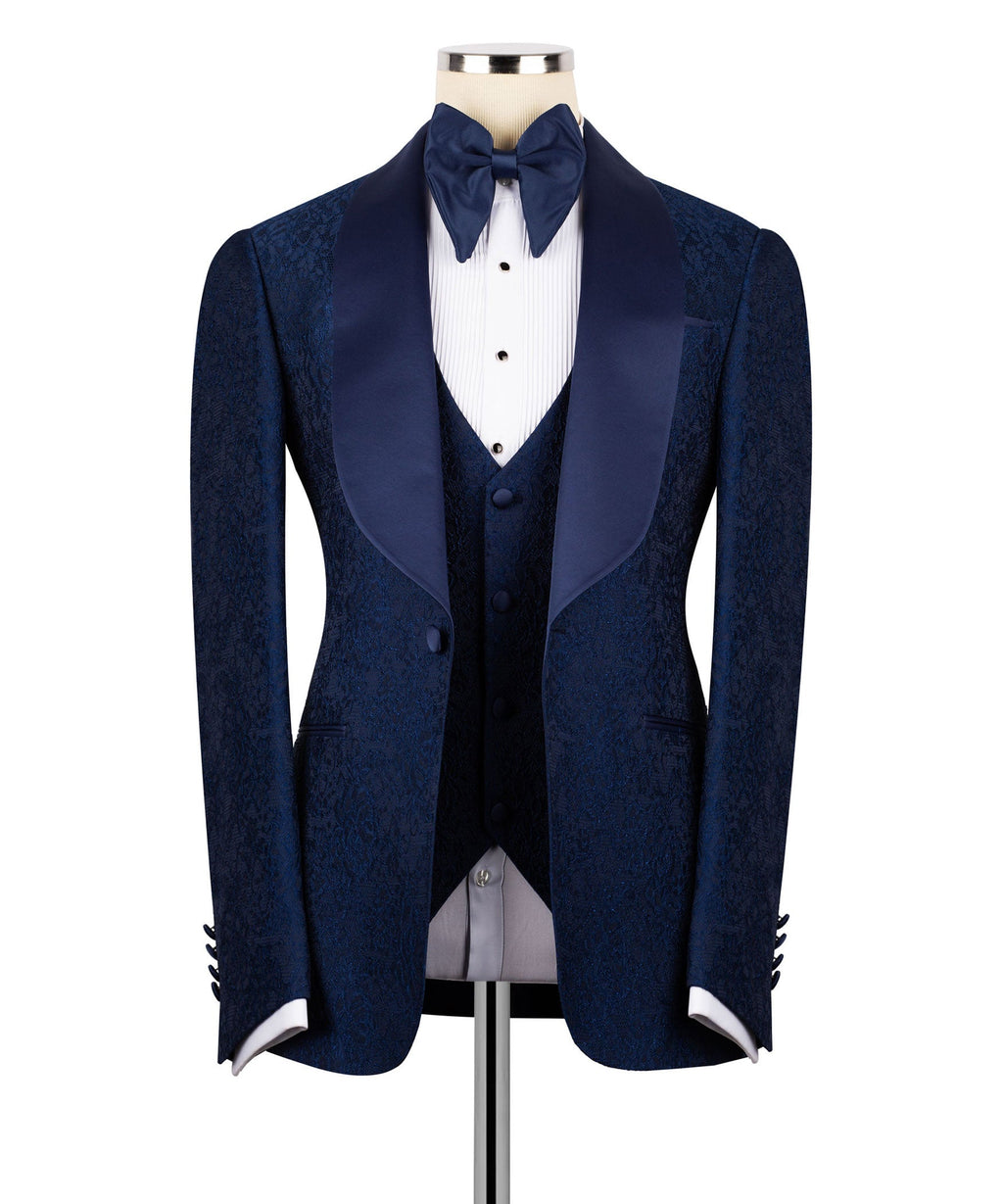 Navy three-piece tuxedo set with bow tie, dress vest, and matching suit jacket