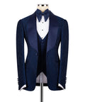 Navy three-piece tuxedo set with bow tie, dress vest, and matching suit jacket