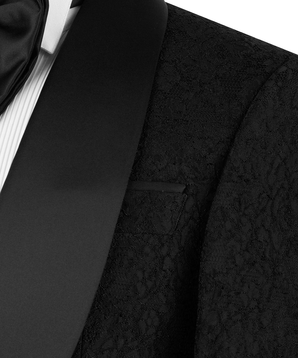 Close-up of black tuxedo lapel and patterned jacket fabric with pocket detail