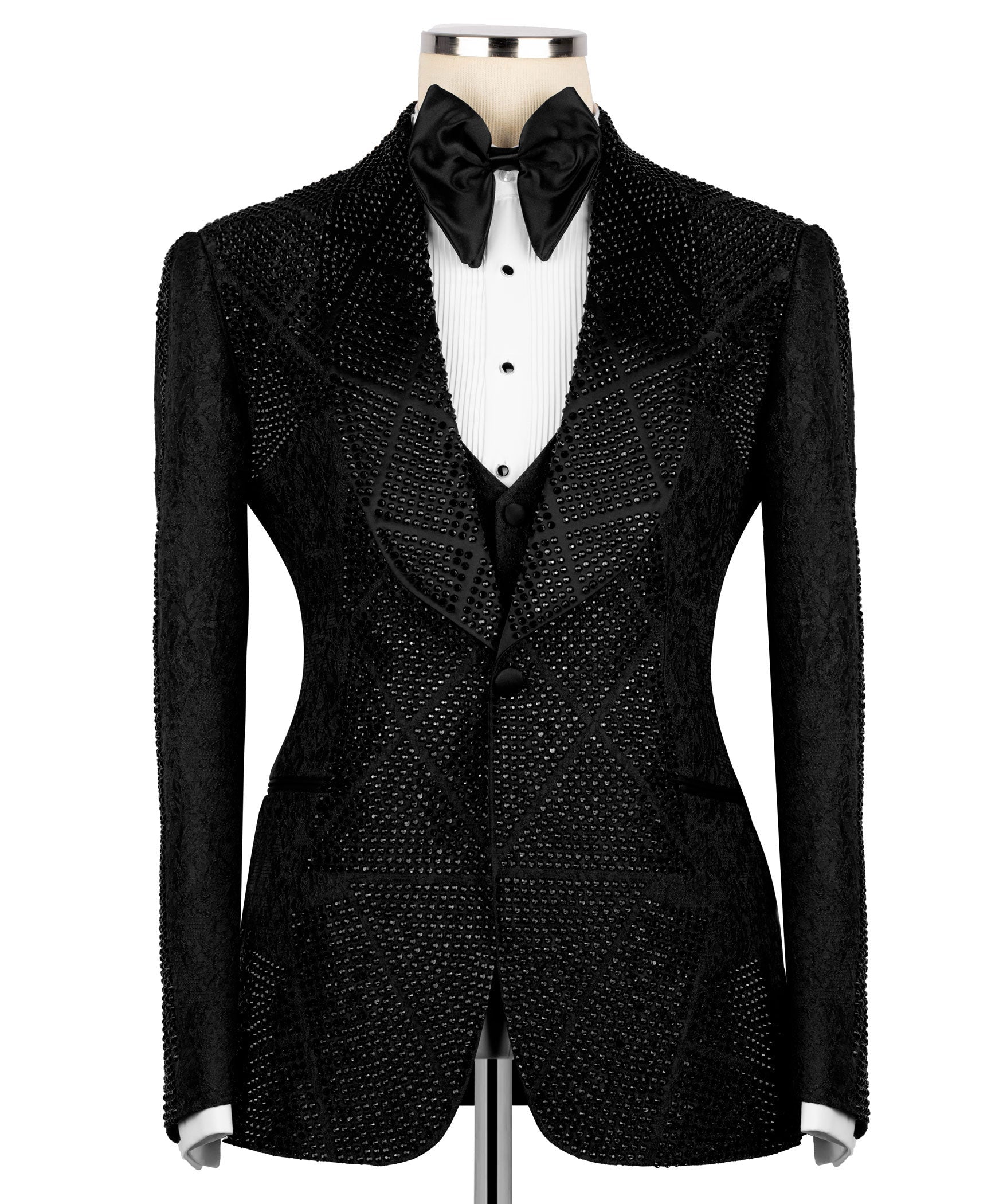 Front view of black stone-embroidered tuxedo jacket with satin bow tie and dark waistcoat