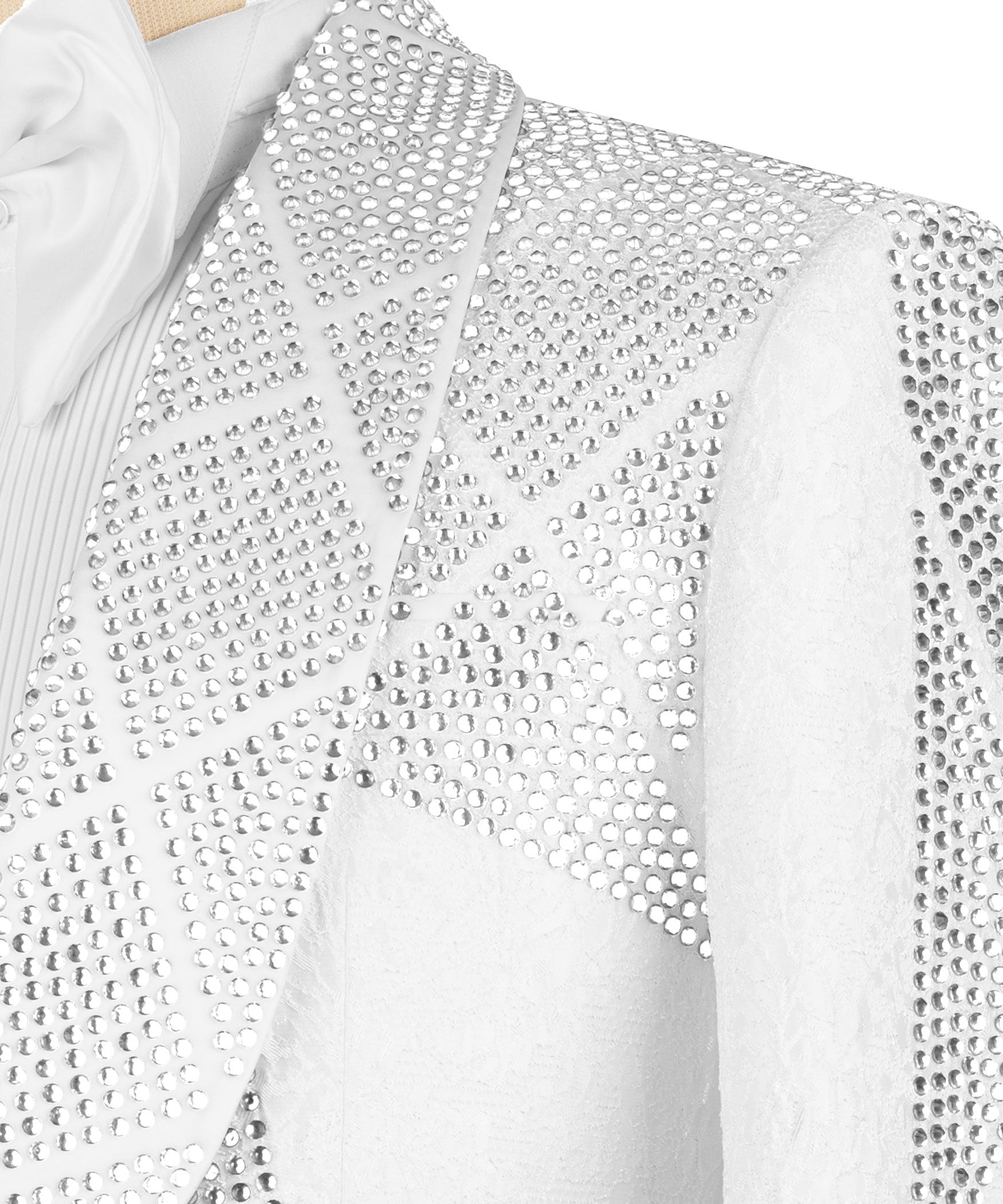 Close-up of white stone-embroidered tuxedo jacket fabric with dense rhinestone texture