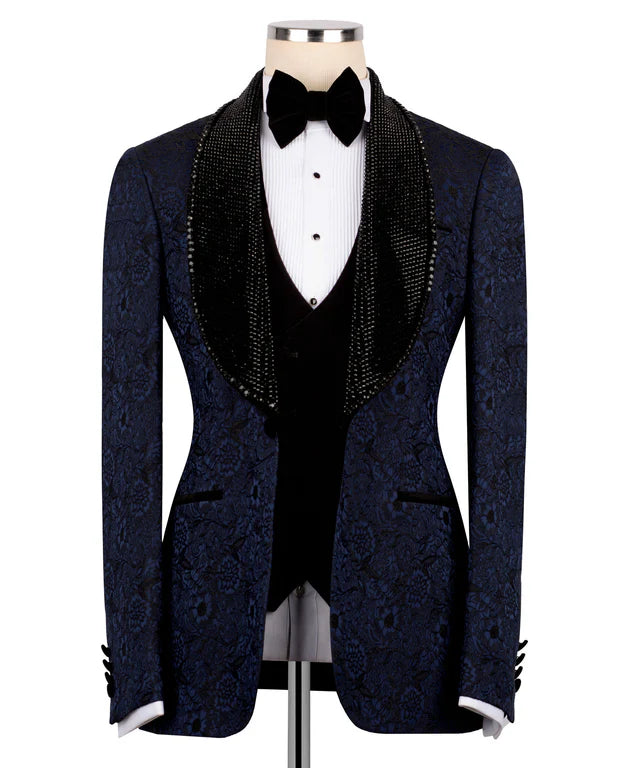 Navy blue patterned tuxedo with black bow tie on a mannequin against a white background