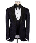 Navy patterned tuxedo jacket with black sequin velvet collar, bow tie, and waistcoat
