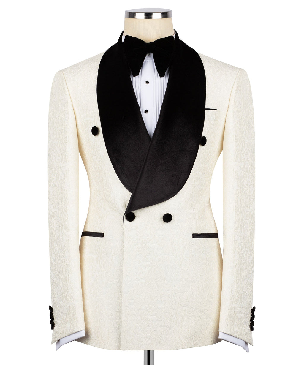 Cream tuxedo jacket with black velvet shawl collar, buttons, and bow front waistcoat