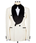 Cream tuxedo jacket with black velvet shawl collar, buttons, and bow front waistcoat