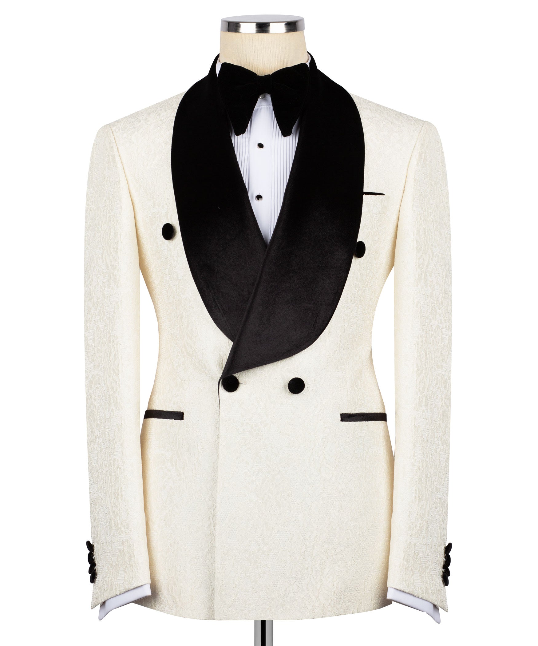 Cream tuxedo jacket with black velvet shawl collar, buttons, and bow front waistcoat