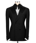 Black tuxedo jacket with satin shawl collar, bow tie, and buttoned waist