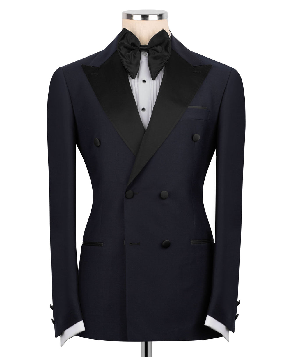 Navy tuxedo jacket with black satin shawl collar and bow tie, six-button front
