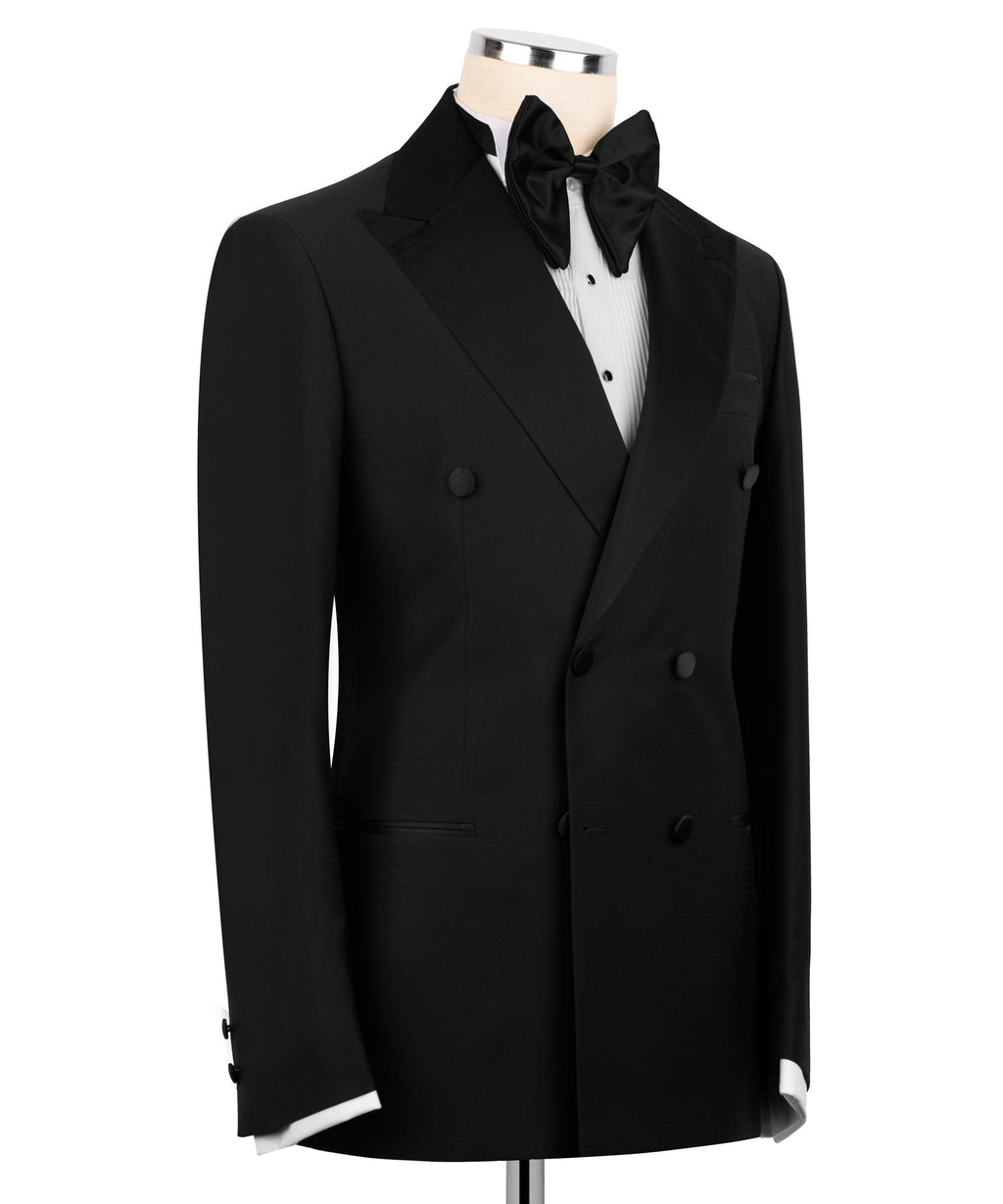Black tuxedo coat with satin lapel, bow tie, and double-breasted button front