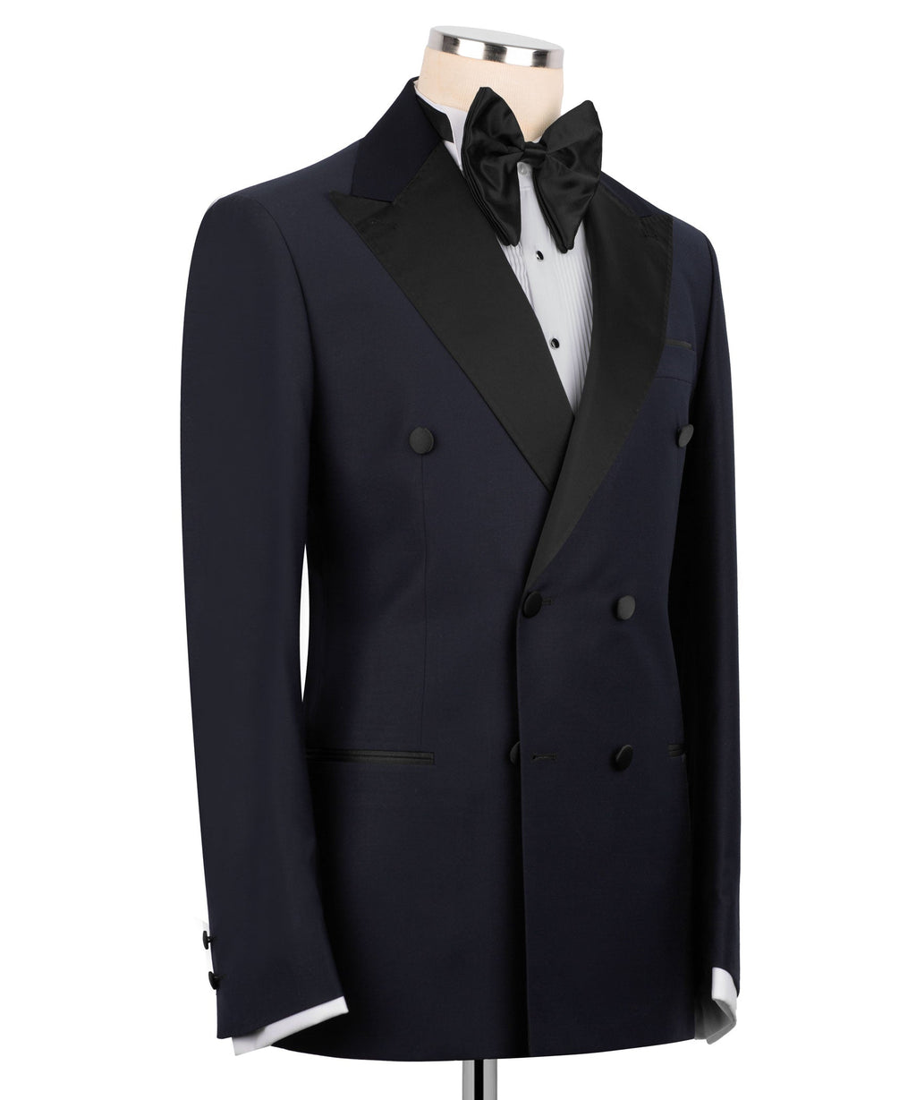 Navy tuxedo jacket with black satin lapels, double-breasted front and covered buttons