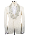 Ivory stone-embroidered tuxedo jacket with bow tie and satin trim, front view