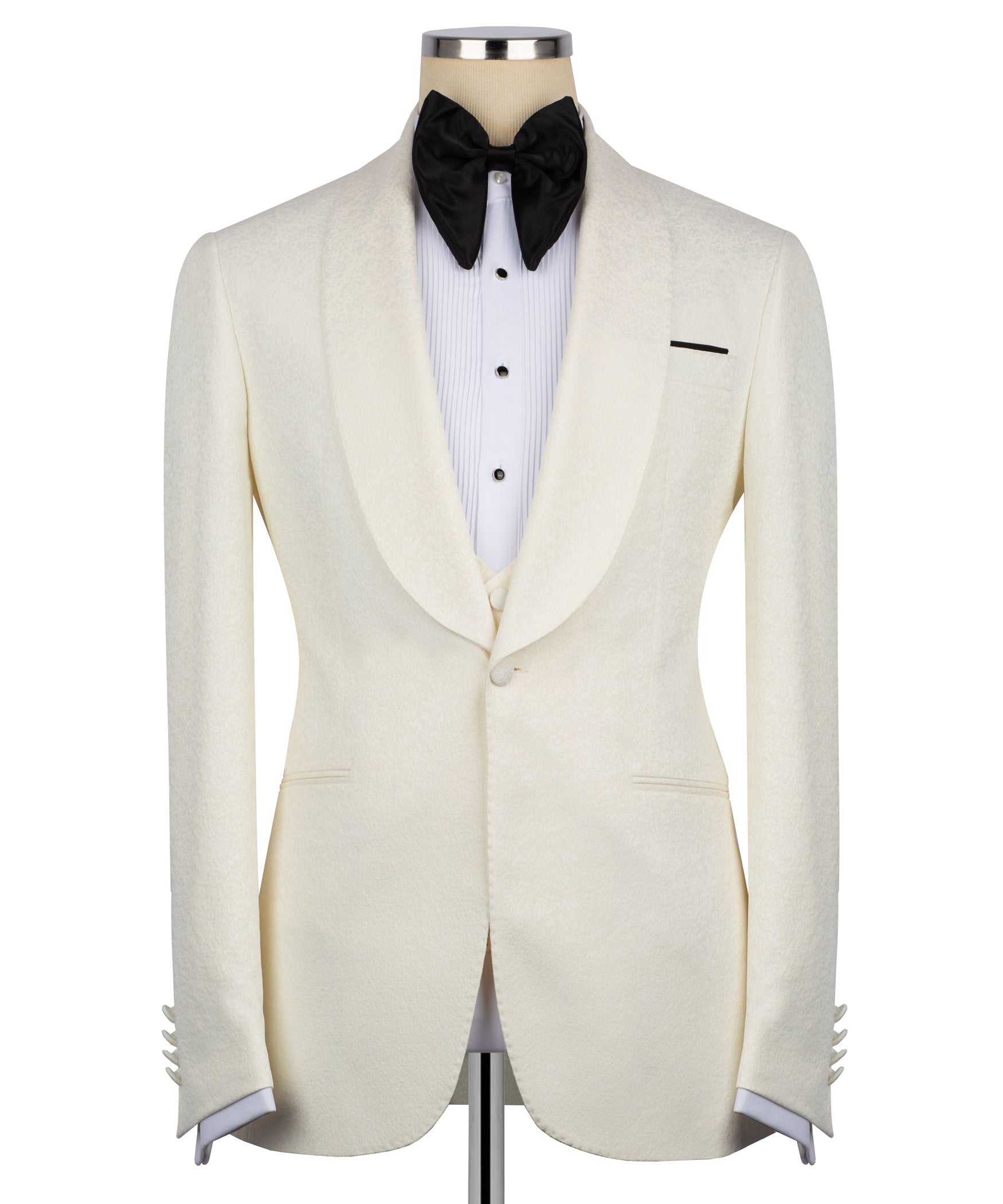 Cream tuxedo jacket front with black bow tie, white striped shirt, and side vents