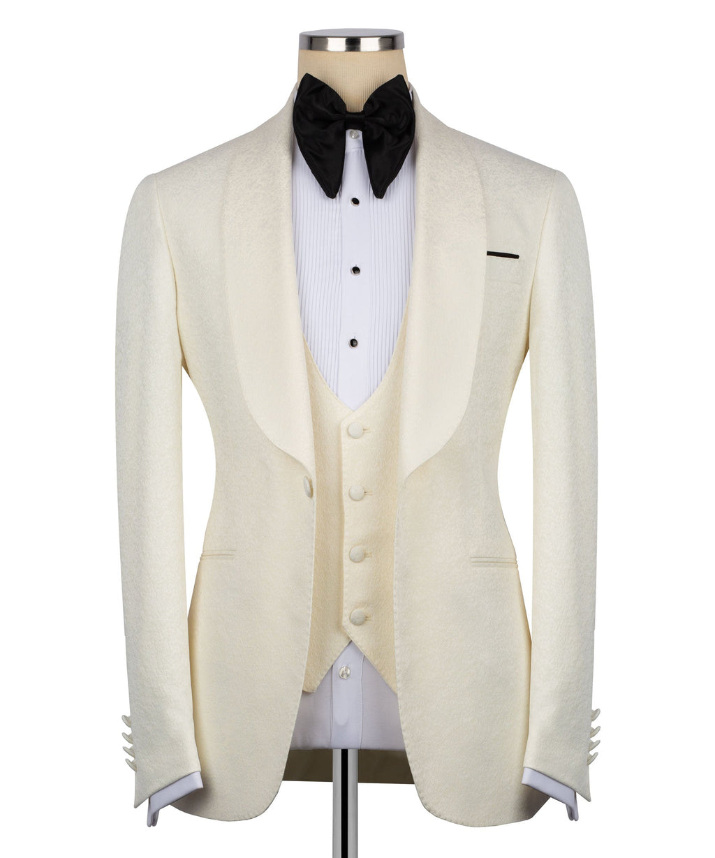 Men’s cream tuxedo jacket with black bow tie and white striped dress shirt
