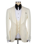 Men’s cream tuxedo jacket with black bow tie and white striped dress shirt