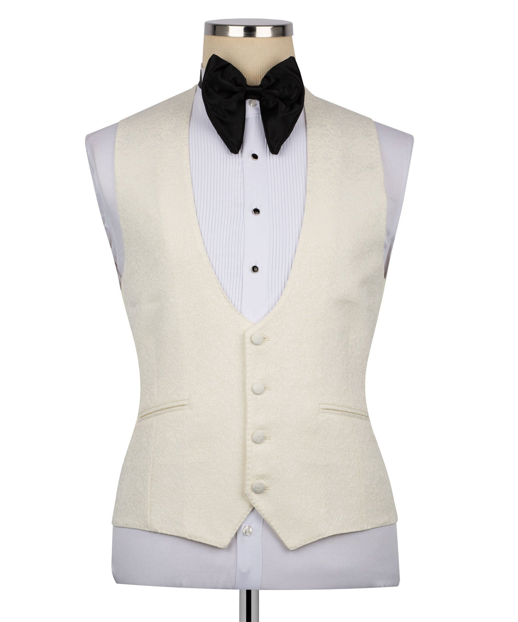 Cream tuxedo waistcoat with button front, black bow tie, and white striped shirt