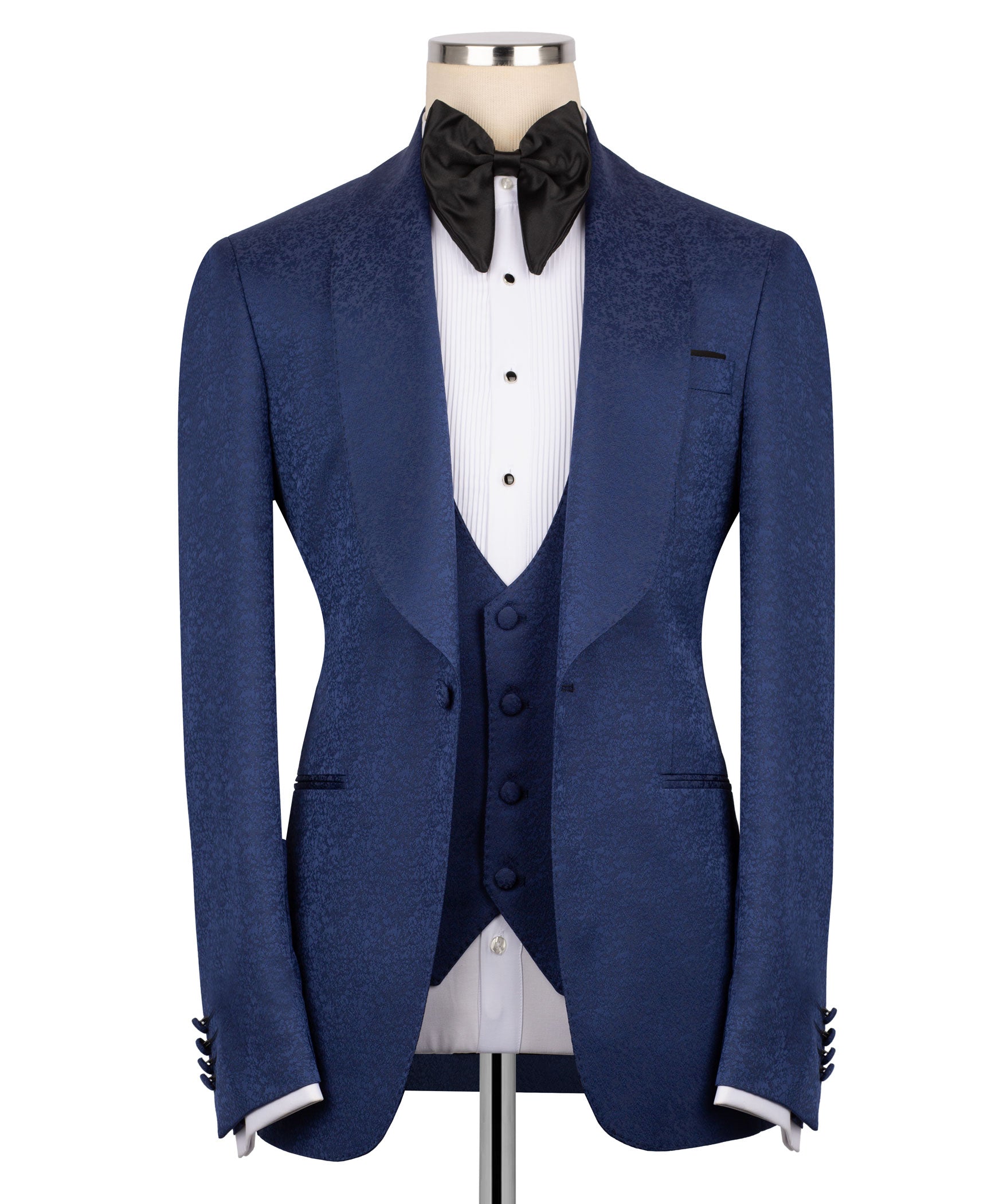 Navy tuxedo jacket with satin peak lapels, black bow tie, and white striped shirt insert