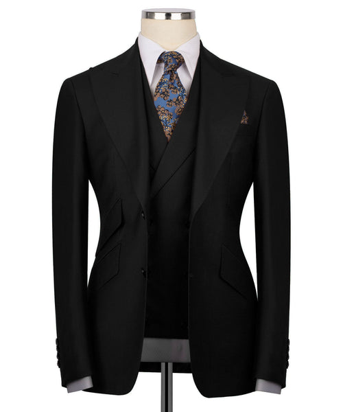 Black 3-piece formal suit: blazer, vest, and patterned necktie on mannequin